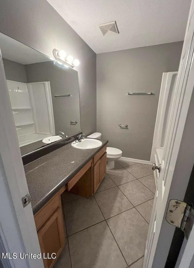 1625 Martin Bluff Rd Unit 97, Gautier, MS 39553 - full bath with vanity, tile patterned flooring, toilet, and baseboards