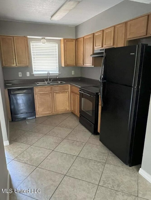 1625 Martin Bluff Rd Unit 97, Gautier, MS 39553 - kitchen featuring black appliances, a sink, dark countertops, and light tile patterned flooring