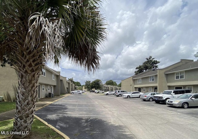 1625 Martin Bluff Rd Unit 97, Gautier, MS 39553 - uncovered parking lot with a residential view