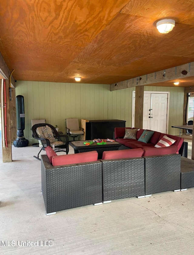 living area with wooden ceiling