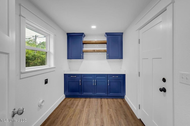 6544 Columbus Cir, Ocean Springs, MS 39564 - laundry area with wood finished floors, cabinet space, hookup for an electric dryer, and recessed lighting