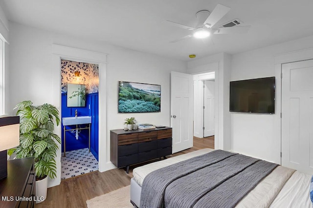 6544 Columbus Cir, Ocean Springs, MS 39564 - bedroom with wood finished floors and ceiling fan