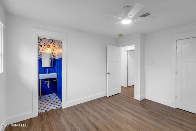 6544 Columbus Cir, Ocean Springs, MS 39564 - unfurnished bedroom featuring wood finished floors, ceiling fan, and a closet