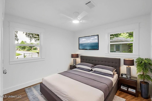 6544 Columbus Cir, Ocean Springs, MS 39564 - bedroom featuring wood finished floors and a ceiling fan