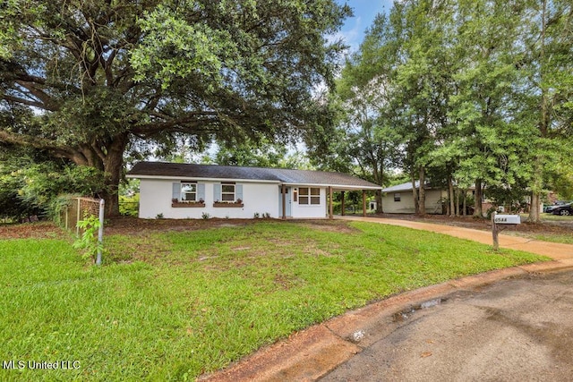 6544 Columbus Cir, Ocean Springs, MS 39564 - single story home with concrete driveway, a front lawn, and a carport