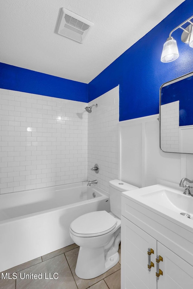 6544 Columbus Cir, Ocean Springs, MS 39564 - full bathroom with vanity, washtub / shower combination, tile patterned floors, a wainscoted wall, and a textured ceiling