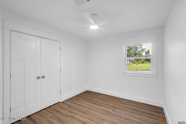 6544 Columbus Cir, Ocean Springs, MS 39564 - unfurnished bedroom featuring wood finished floors, a closet, and a ceiling fan