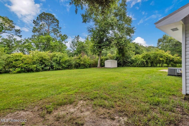 6544 Columbus Cir, Ocean Springs, MS 39564 - view of grassy yard with a storage unit
