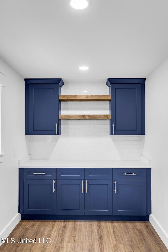 6544 Columbus Cir, Ocean Springs, MS 39564 - bar area with wood finished floors and tasteful backsplash