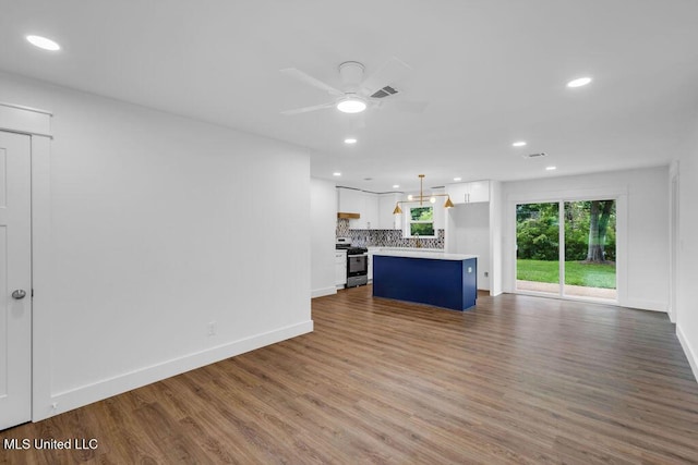6544 Columbus Cir, Ocean Springs, MS 39564 - unfurnished living room with wood finished floors, a ceiling fan, and recessed lighting
