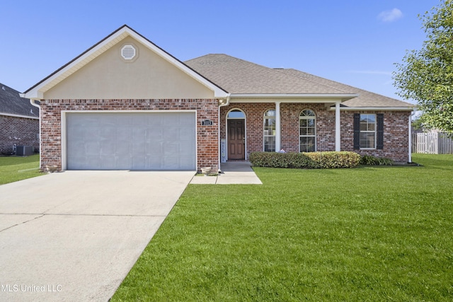 ranch-style house with roof with shingles, an attached garage, driveway, and a front yard