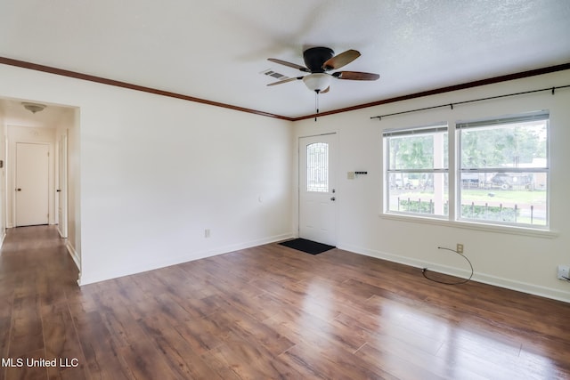 interior space with ceiling fan, baseboards, visible vents, and dark wood finished floors
