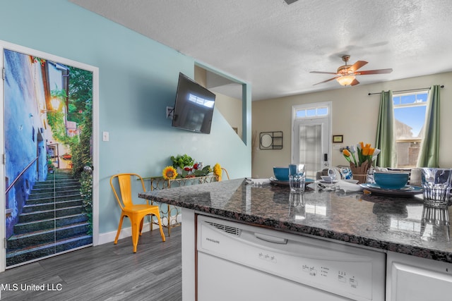 kitchen featuring white dishwasher, a textured ceiling, white cabinetry, ceiling fan, and dark hardwood / wood-style floors