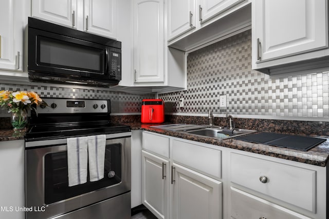 kitchen with white cabinetry, backsplash, and stainless steel electric range