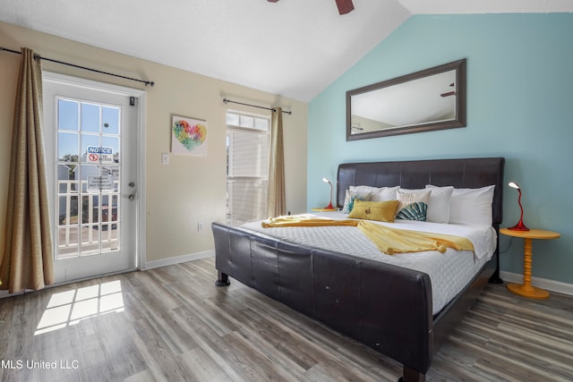 bedroom with lofted ceiling, multiple windows, access to exterior, and ceiling fan