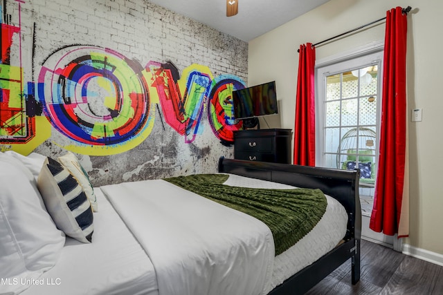 bedroom with ceiling fan and dark hardwood / wood-style floors