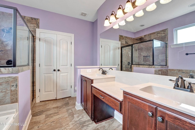 bathroom with double vanity, a sink, visible vents, and a shower stall