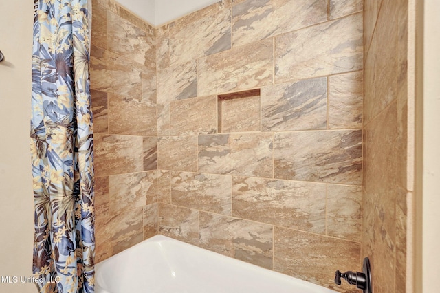 bathroom featuring shower / bath combination with curtain