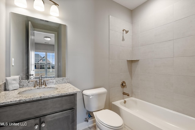 full bathroom with baseboards, tub / shower combination, vanity, and toilet