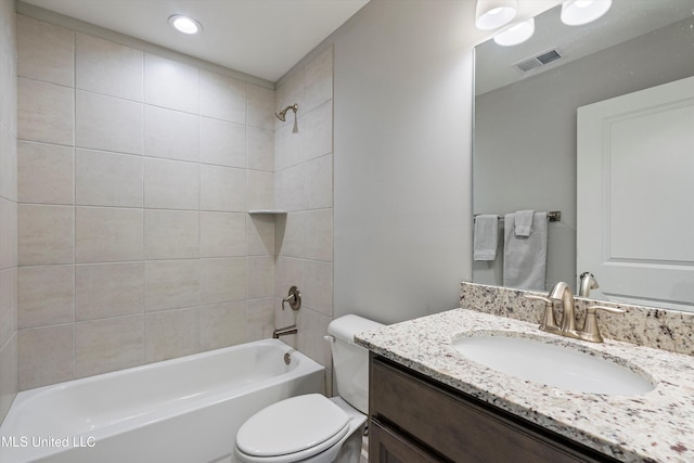 bathroom with toilet, shower / tub combination, vanity, and visible vents