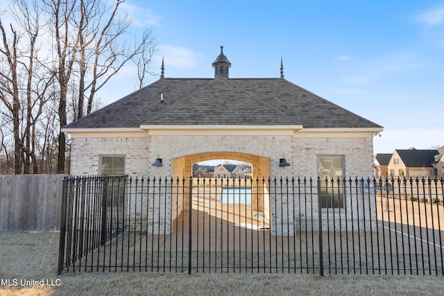 view of gate featuring a fenced front yard