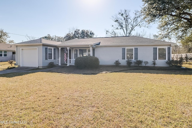 ranch-style home with driveway, a front lawn, and an attached garage