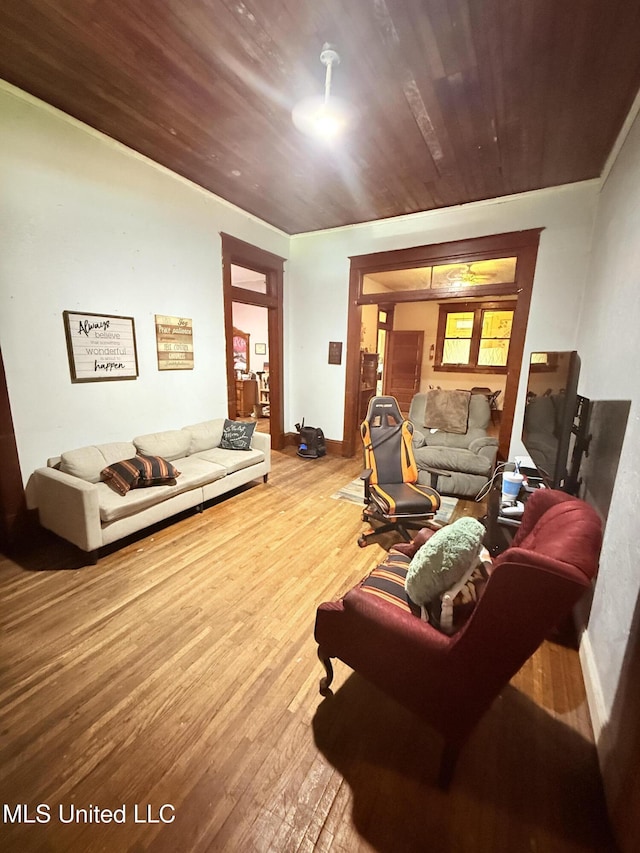 1057 Adams St, Grenada, MS 38901 - living room with wood-type flooring, baseboards, and wood ceiling