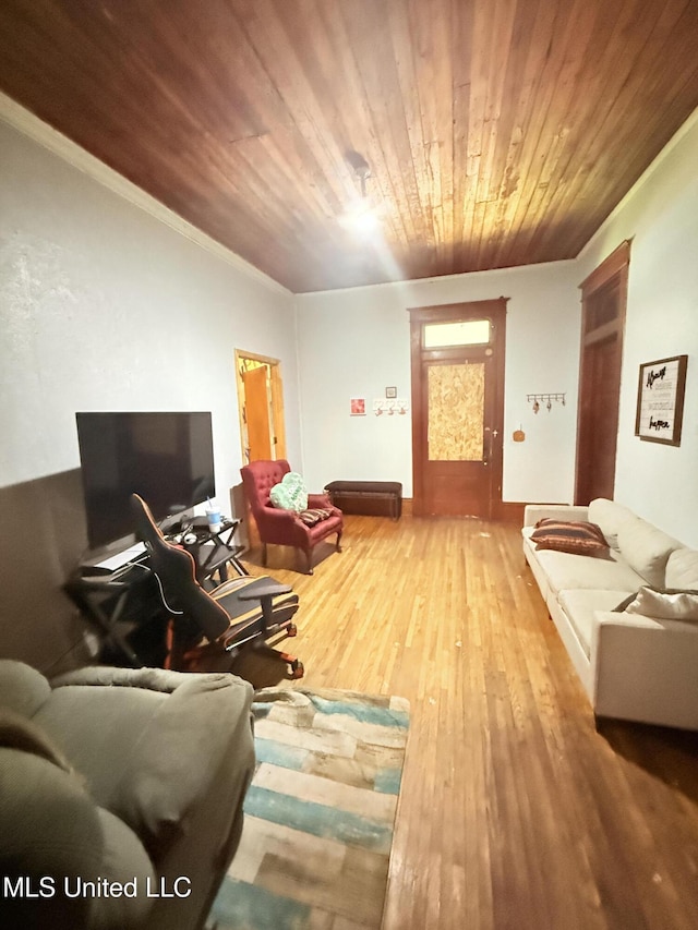 1057 Adams St, Grenada, MS 38901 - living area with wood ceiling, wood finished floors, and ornamental molding