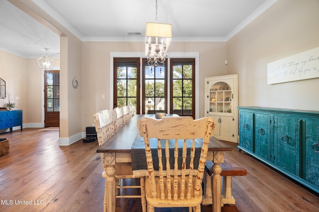 1075 S Laughter Rd, Hernando, MS 38632 - dining area with a chandelier, plenty of natural light, hardwood / wood-style flooring, and crown molding
