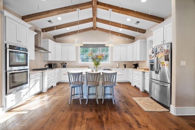 1075 S Laughter Rd, Hernando, MS 38632 - kitchen featuring stainless steel appliances, wall chimney range hood, a kitchen island, light countertops, and recessed lighting