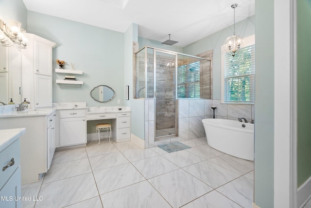 1075 S Laughter Rd, Hernando, MS 38632 - full bath featuring vanity, a stall shower, a chandelier, a freestanding tub, and tile patterned flooring
