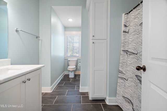 1075 S Laughter Rd, Hernando, MS 38632 - full bathroom with vanity, tile patterned floors, toilet, and baseboards
