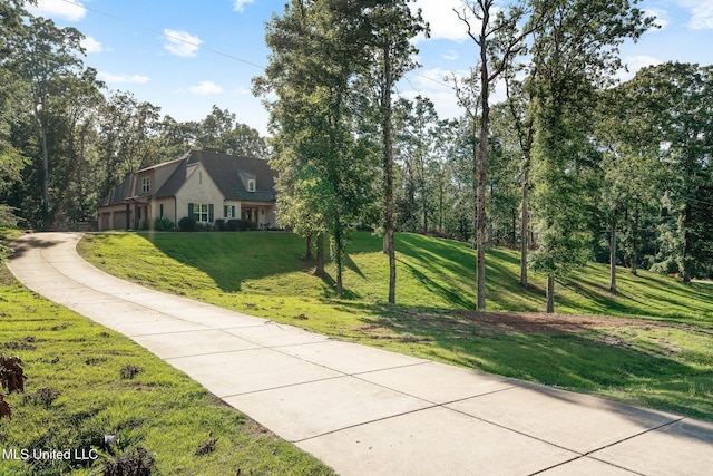 1075 S Laughter Rd, Hernando, MS 38632 - view of side of property featuring a yard and driveway