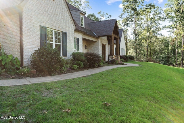 1075 S Laughter Rd, Hernando, MS 38632 - view of side of home featuring a yard, brick siding, and roof with shingles