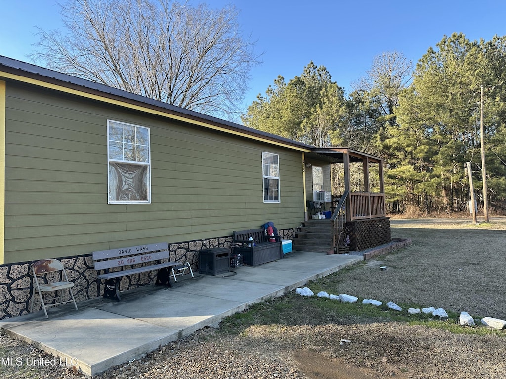 view of property exterior featuring a patio