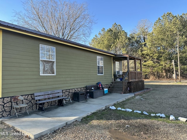 view of property exterior featuring a patio