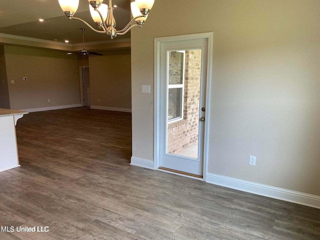 unfurnished dining area featuring ceiling fan, ornamental molding, and dark hardwood / wood-style flooring