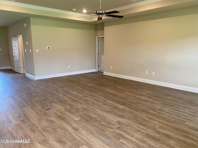 unfurnished room with crown molding, dark hardwood / wood-style floors, and ceiling fan