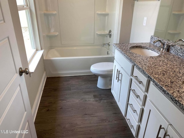 full bathroom with vanity, shower / tub combination, wood-type flooring, and toilet