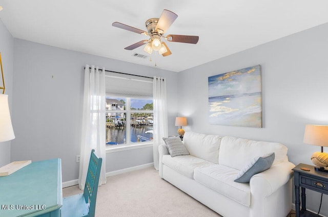 2421 Beachview Dr Unit B02, Ocean Springs, MS 39564 - carpeted living room featuring baseboards, a water view, a ceiling fan, and visible vents