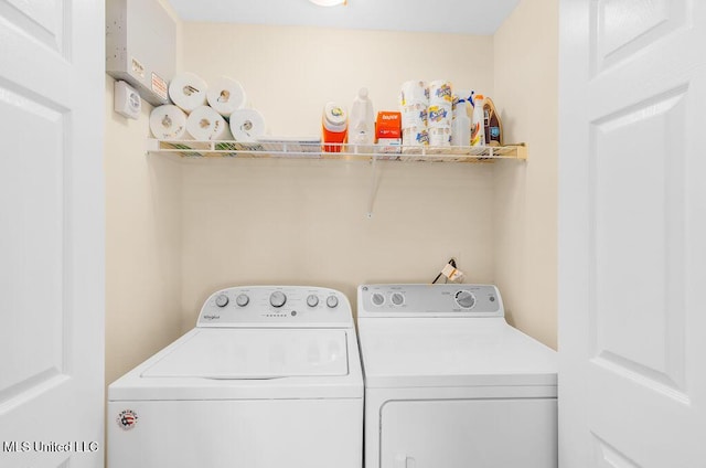 2421 Beachview Dr Unit B02, Ocean Springs, MS 39564 - clothes washing area with laundry area and washing machine and dryer