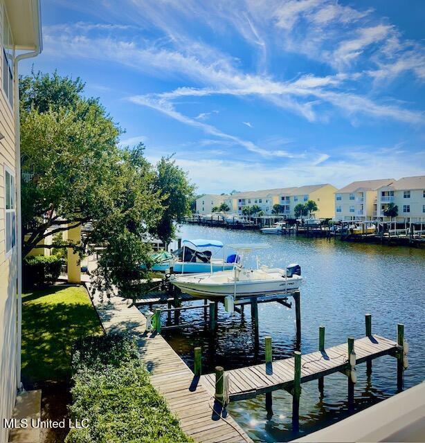 2421 Beachview Dr Unit B02, Ocean Springs, MS 39564 - view of dock with a residential view, boat lift, and a water view