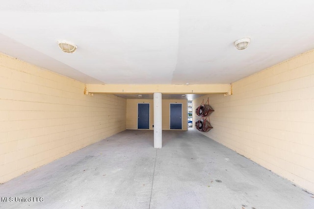 2421 Beachview Dr Unit B02, Ocean Springs, MS 39564 - basement featuring a garage and concrete block wall