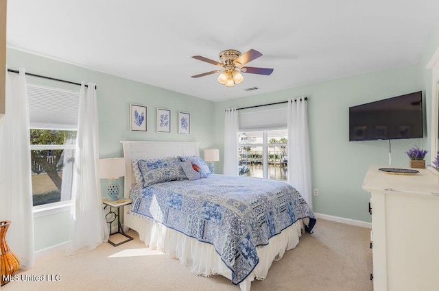 2421 Beachview Dr Unit B02, Ocean Springs, MS 39564 - bedroom featuring carpet floors, baseboards, a ceiling fan, and visible vents