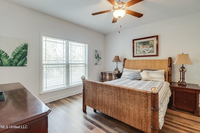 bedroom with ceiling fan and dark hardwood / wood-style flooring