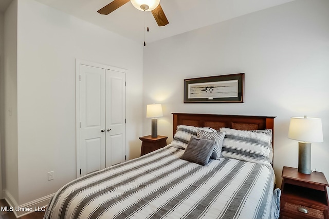 bedroom with ceiling fan and a closet