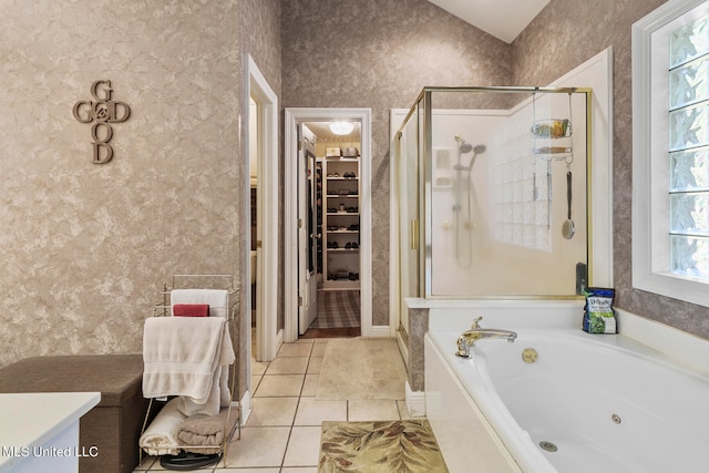 bathroom featuring tile patterned floors, independent shower and bath, and plenty of natural light