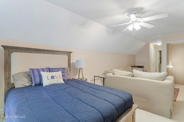 bedroom with ceiling fan, lofted ceiling, and carpet floors