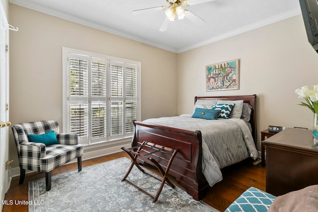 bedroom featuring dark wood-type flooring, crown molding, and ceiling fan