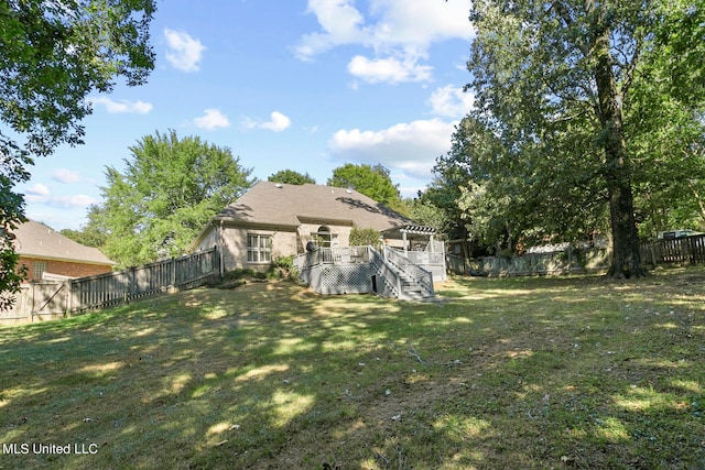 view of yard with a wooden deck